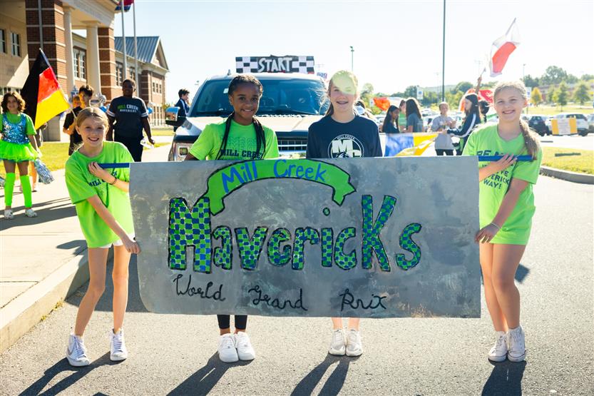 Students march in a homecoming parade